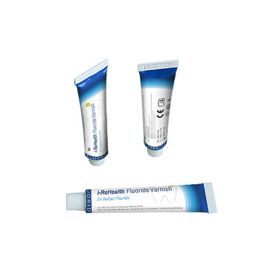 O fluoreto dental tópico NAF do verniz do sabor 5% do melão impede a cárie dental